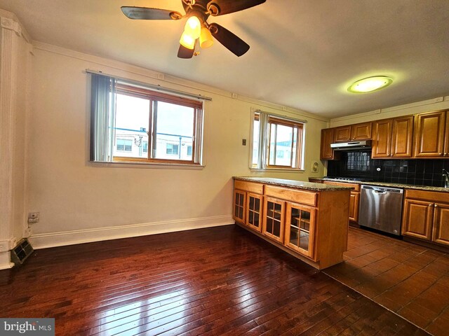 1506 N 13th St, Philadelphia, PA 19122 - kitchen with dishwasher, under cabinet range hood, brown cabinets, and dark wood-style flooring