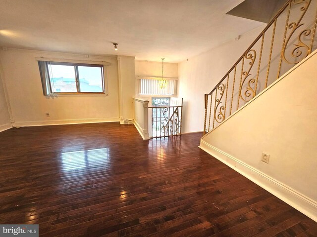 1506 N 13th St, Philadelphia, PA 19122 - unfurnished living room featuring hardwood / wood-style floors and baseboards