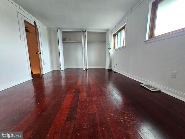 1506 N 13th St, Philadelphia, PA 19122 - unfurnished bedroom with wood-type flooring, baseboards, and a closet