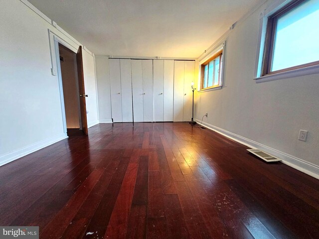 1506 N 13th St, Philadelphia, PA 19122 - unfurnished bedroom featuring wood-type flooring, baseboards, and a closet