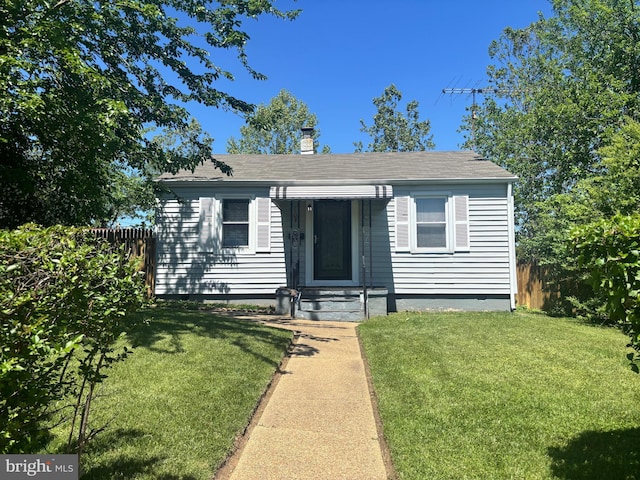 1802 Kittyhawk Rd, Baltimore, MD 21221 - view of front of home featuring a chimney and roof with shingles