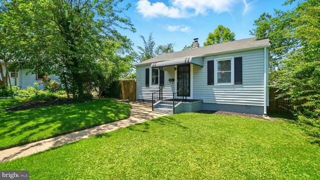1802 Kittyhawk Rd, Baltimore, MD 21221 - view of front facade featuring a chimney