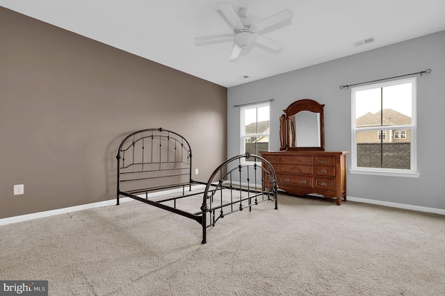 carpeted bedroom with baseboards
