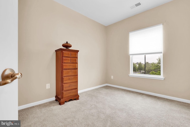 empty room with carpet flooring and baseboards