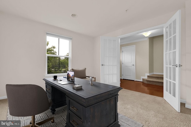 carpeted office featuring french doors and baseboards