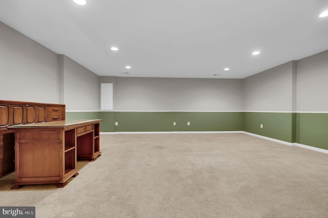 below grade area with recessed lighting, light colored carpet, and baseboards