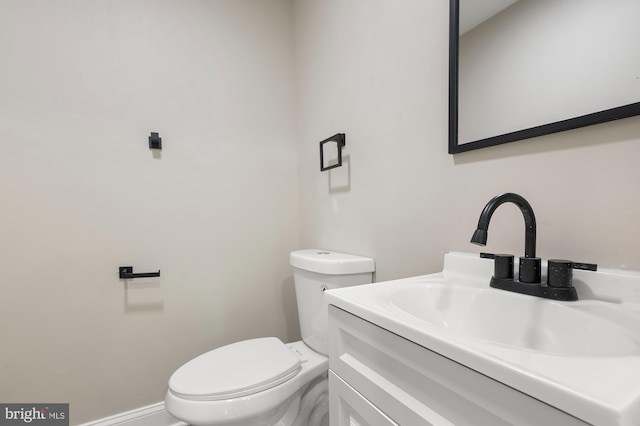 1208 Krueger Ave, Rosedale, MD 21237 - bathroom with toilet, vanity, and baseboards