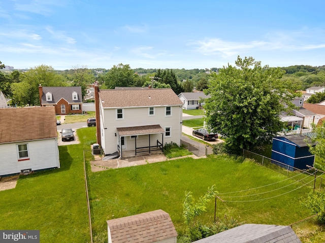 1208 Krueger Ave, Rosedale, MD 21237 - back of house with a residential view, a chimney, a patio area, and cooling unit