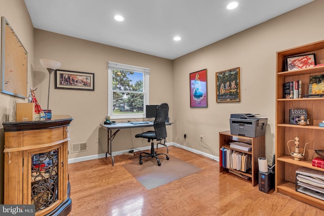 office area with wood finished floors, recessed lighting, and baseboards