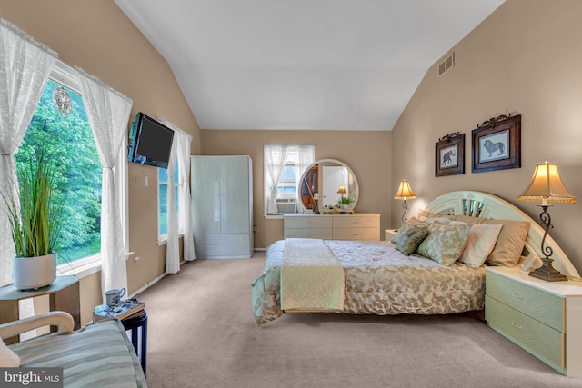 bedroom with carpet, lofted ceiling, and cooling unit