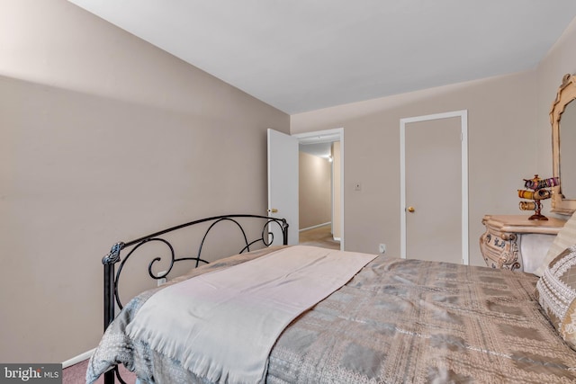 carpeted bedroom with baseboards