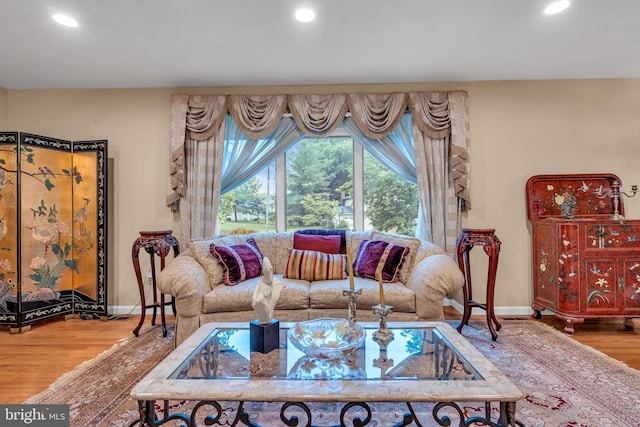 living area featuring wood finished floors, recessed lighting, and baseboards