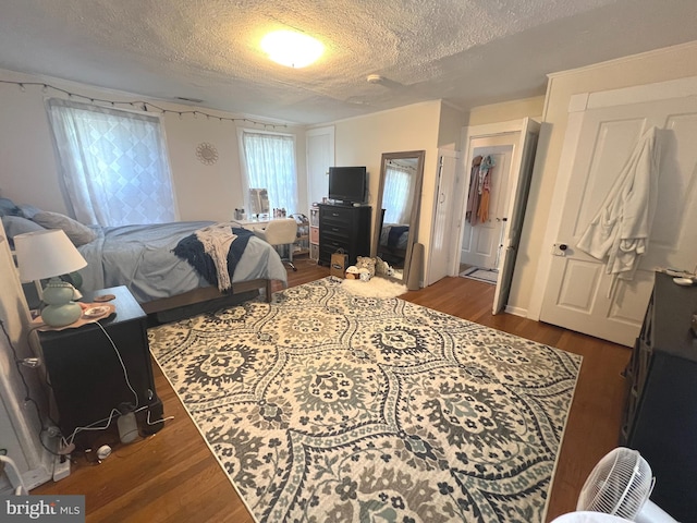 619 S Cameron St, Winchester, VA 22601 - bedroom with a textured ceiling and dark wood finished floors