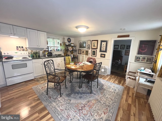 619 S Cameron St, Winchester, VA 22601 - dining space with wood finished floors and wainscoting