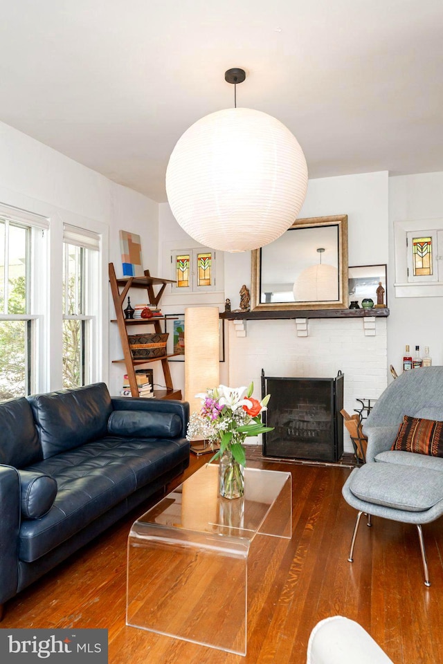 730 Fillmore St, Harpers Ferry, WV 25425 - living room with hardwood / wood-style flooring and a brick fireplace
