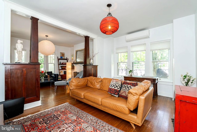 730 Fillmore St, Harpers Ferry, WV 25425 - living area featuring a wall mounted air conditioner, dark wood-type flooring, and ornate columns