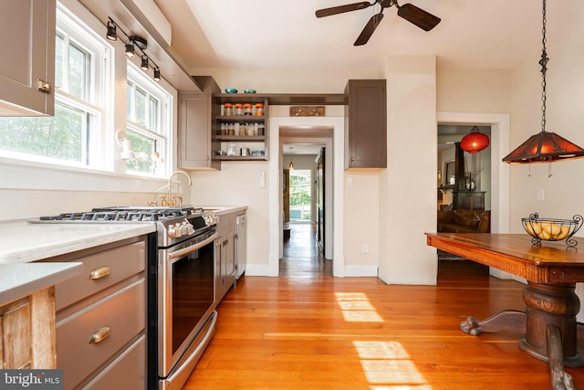 730 Fillmore St, Harpers Ferry, WV 25425 - kitchen featuring stainless steel gas range, light countertops, ceiling fan, light wood finished floors, and open shelves