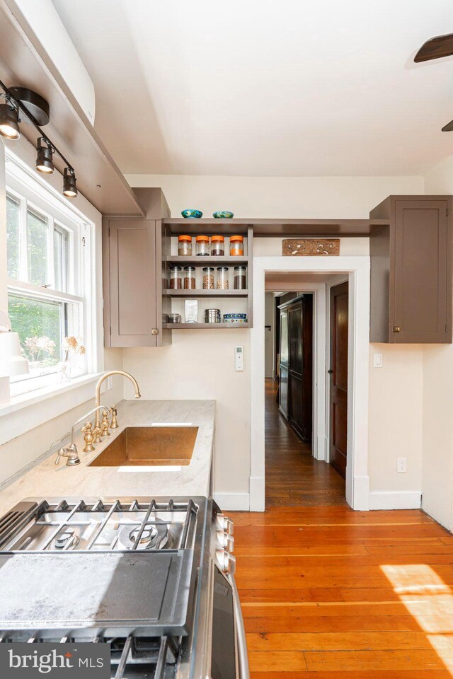730 Fillmore St, Harpers Ferry, WV 25425 - kitchen featuring a sink, open shelves, light countertops, light wood-type flooring, and stainless steel gas stove