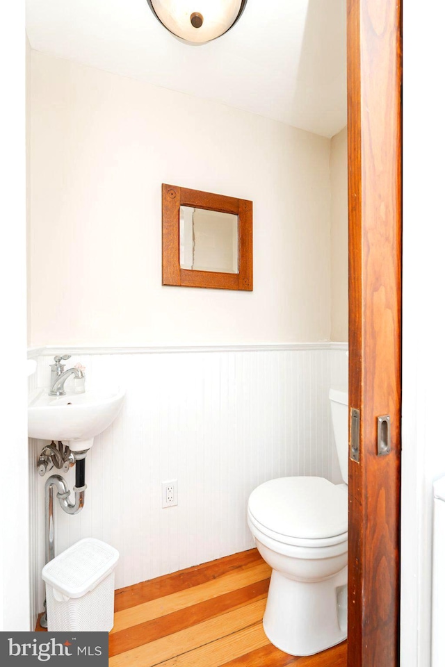 730 Fillmore St, Harpers Ferry, WV 25425 - bathroom featuring wood finished floors, a wainscoted wall, and toilet