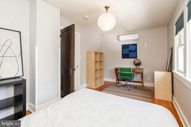730 Fillmore St, Harpers Ferry, WV 25425 - bedroom featuring a wall mounted AC, wood finished floors, beverage cooler, and baseboards
