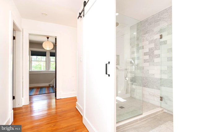 730 Fillmore St, Harpers Ferry, WV 25425 - bathroom with a shower stall, wood finished floors, and baseboards