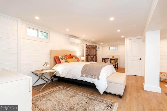 730 Fillmore St, Harpers Ferry, WV 25425 - bedroom featuring light wood-style flooring, recessed lighting, multiple windows, a wall mounted AC, and wooden walls