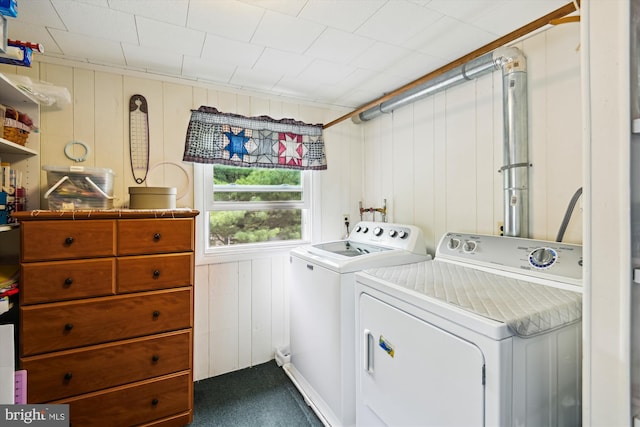 clothes washing area featuring independent washer and dryer