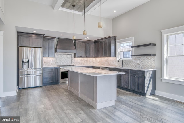 1306 N Barnegat Ave, Surf City, NJ 08008 - kitchen featuring stainless steel appliances, custom range hood, a sink, a high ceiling, and open shelves