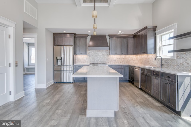 1306 N Barnegat Ave, Surf City, NJ 08008 - kitchen with stainless steel appliances, a sink, custom exhaust hood, a high ceiling, and open shelves