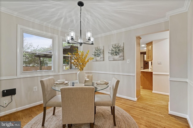 14906 Cranoke St, Centreville, VA 20120 - dining space with a chandelier, wood finished floors, crown molding, and baseboards