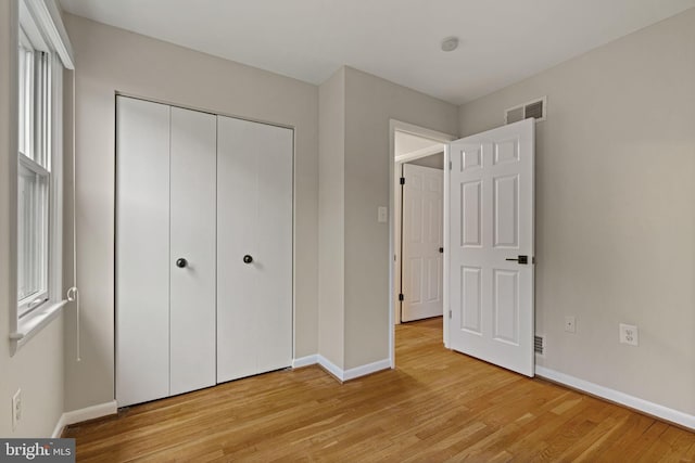 14906 Cranoke St, Centreville, VA 20120 - unfurnished bedroom with baseboards, light wood finished floors, and a closet