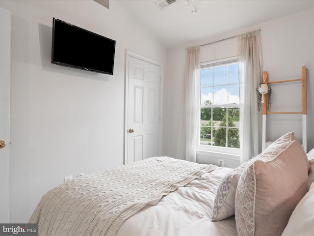 bedroom featuring vaulted ceiling