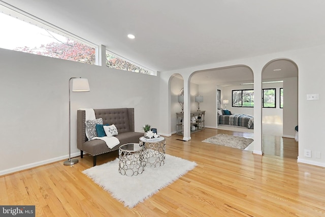 4124 Watkins Trl, Annandale, VA 22003 - living room featuring arched walkways, wood finished floors, recessed lighting, lofted ceiling, and baseboards