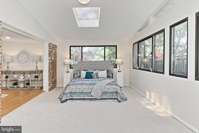 4124 Watkins Trl, Annandale, VA 22003 - bedroom featuring vaulted ceiling, light colored carpet, baseboards, and a skylight