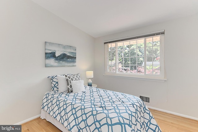4124 Watkins Trl, Annandale, VA 22003 - bedroom featuring wood finished floors, baseboards, and vaulted ceiling