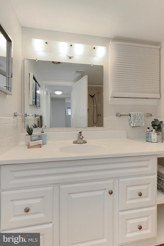 4124 Watkins Trl, Annandale, VA 22003 - bathroom featuring backsplash, vanity, and a shower