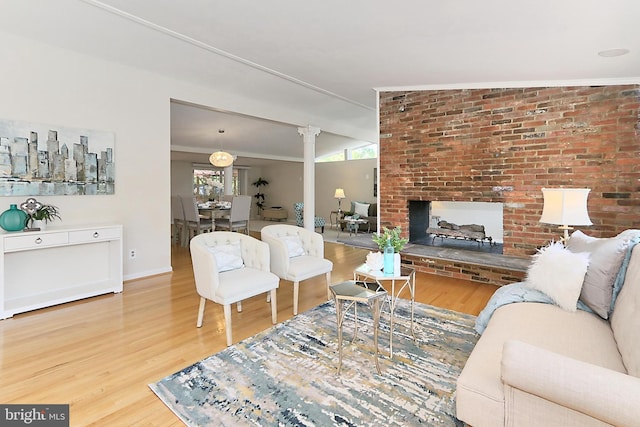 4124 Watkins Trl, Annandale, VA 22003 - living room with wood finished floors, baseboards, and a brick fireplace