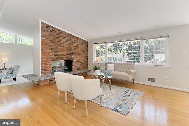 4124 Watkins Trl, Annandale, VA 22003 - living room with wood finished floors, baseboards, vaulted ceiling, and a fireplace