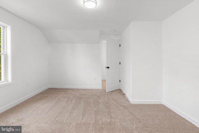 2506 Chelsea Ter, Baltimore, MD 21216 - additional living space featuring carpet flooring, baseboards, and vaulted ceiling