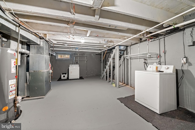 below grade area with washer / clothes dryer, water heater, and heating unit