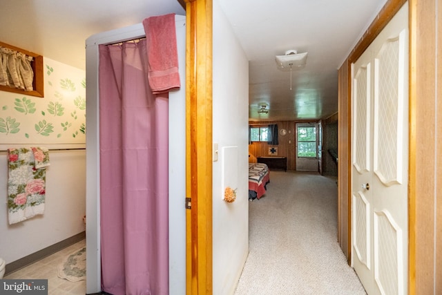 corridor with light colored carpet