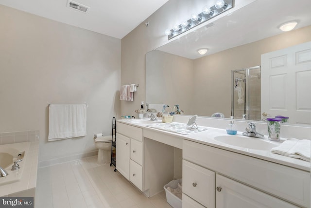 full bathroom featuring toilet, a shower stall, tile patterned floors, and double vanity
