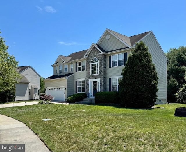 view of front facade featuring a garage, a front lawn, and stone siding