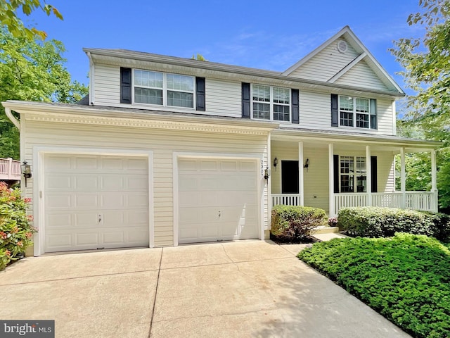 2307 Springdale Ln, Waldorf, MD 20603 - traditional home with driveway, a porch, and a garage