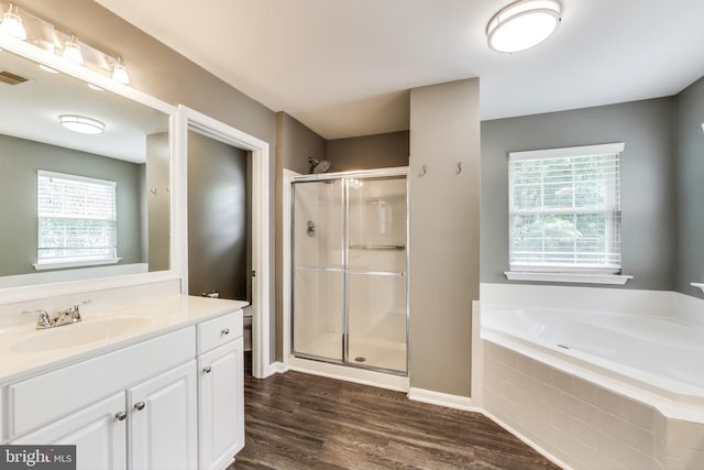 2307 Springdale Ln, Waldorf, MD 20603 - full bathroom featuring vanity, a shower stall, a bath, and healthy amount of natural light