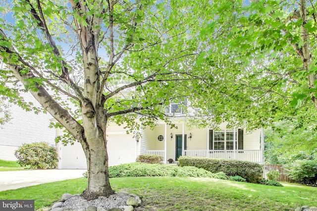 2307 Springdale Ln, Waldorf, MD 20603 - obstructed view of property featuring covered porch, driveway, and an attached garage
