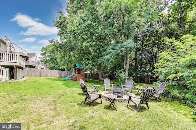 2307 Springdale Ln, Waldorf, MD 20603 - fenced backyard with a playground and an outdoor fire pit