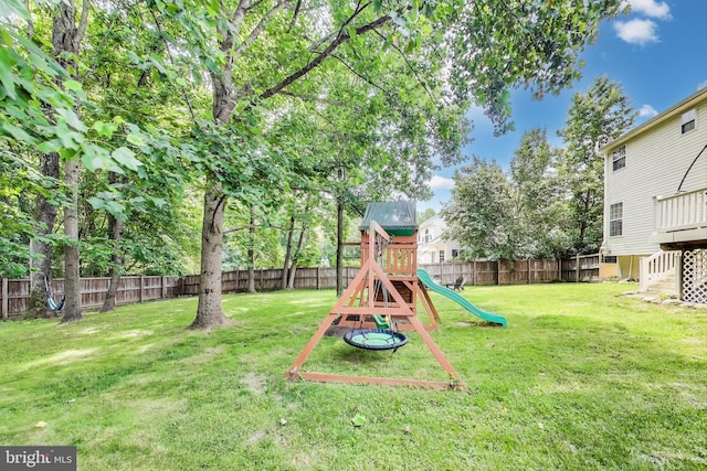 2307 Springdale Ln, Waldorf, MD 20603 - view of play area with a fenced backyard, stairs, and a wooden deck