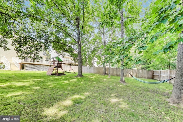 2307 Springdale Ln, Waldorf, MD 20603 - fenced backyard featuring a playground and a wooden deck