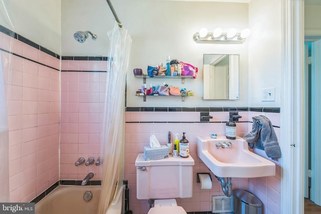 2217 Observatory Pl NW, Washington, DC 20007 - bathroom featuring tile walls, shower / bath combo, toilet, a sink, and wainscoting